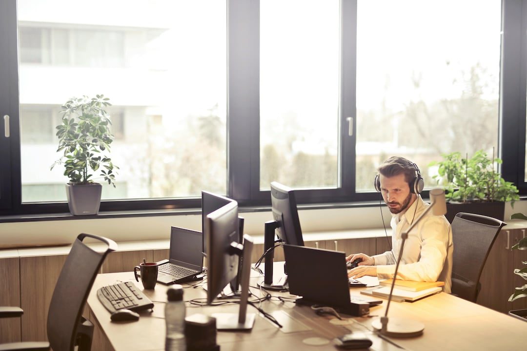 Customer service man sitting at desk