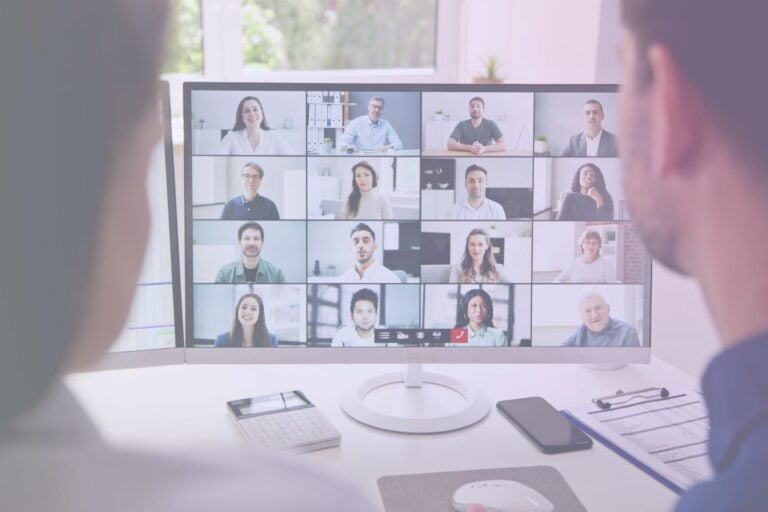 professional business meeting with team members reviewing AI agent workflow dashboard on large screen