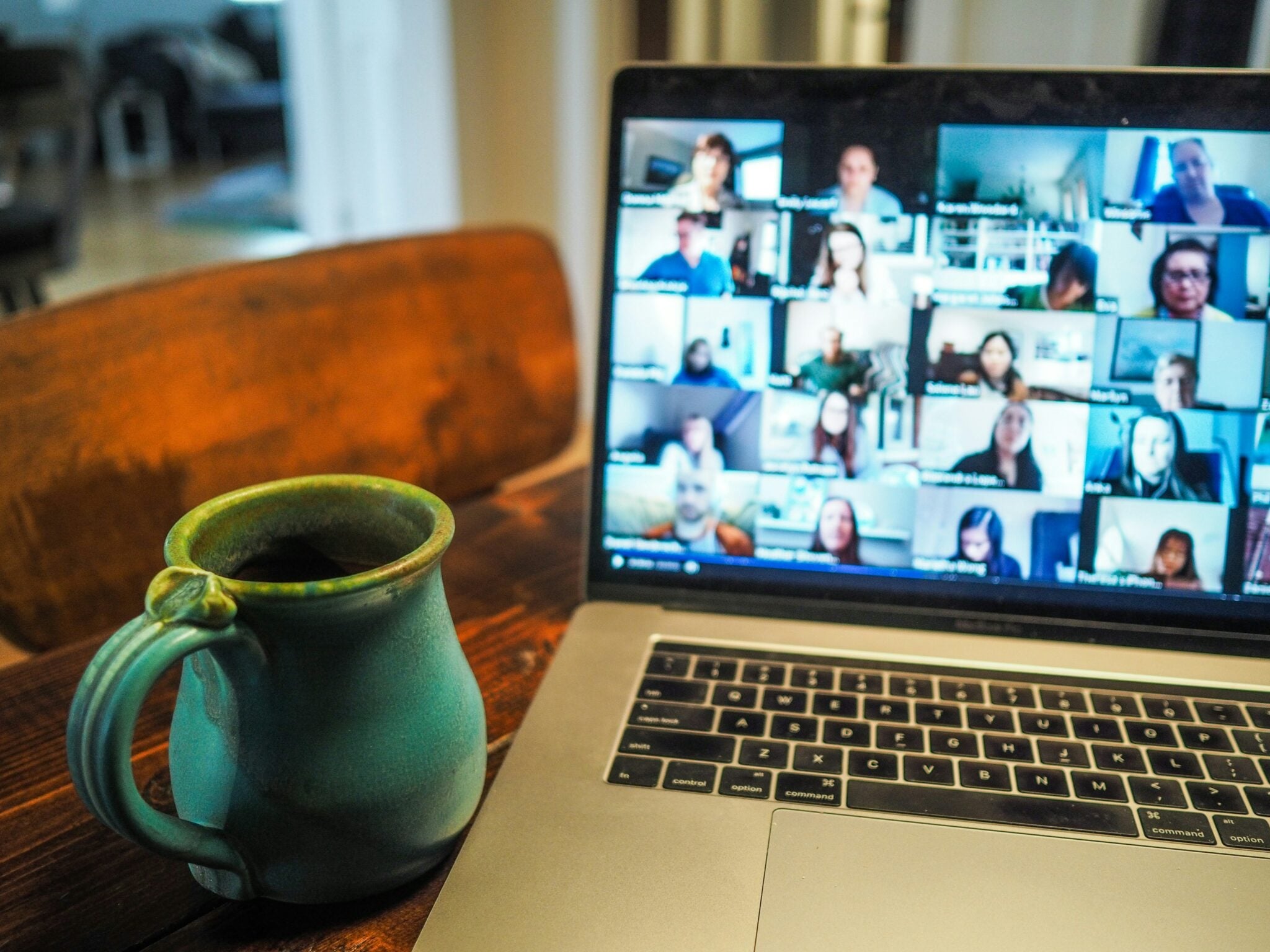 Photo of a video meeting on a laptop.